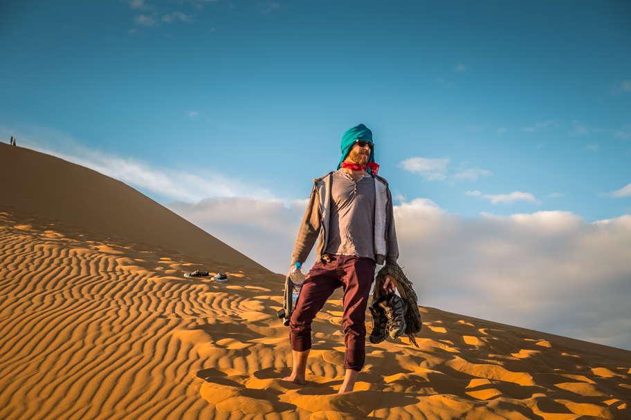 Male tourist on a sand dune, Sahara Desert, Morocco | Barbara Cameron Pix | Food & Travel Photographer