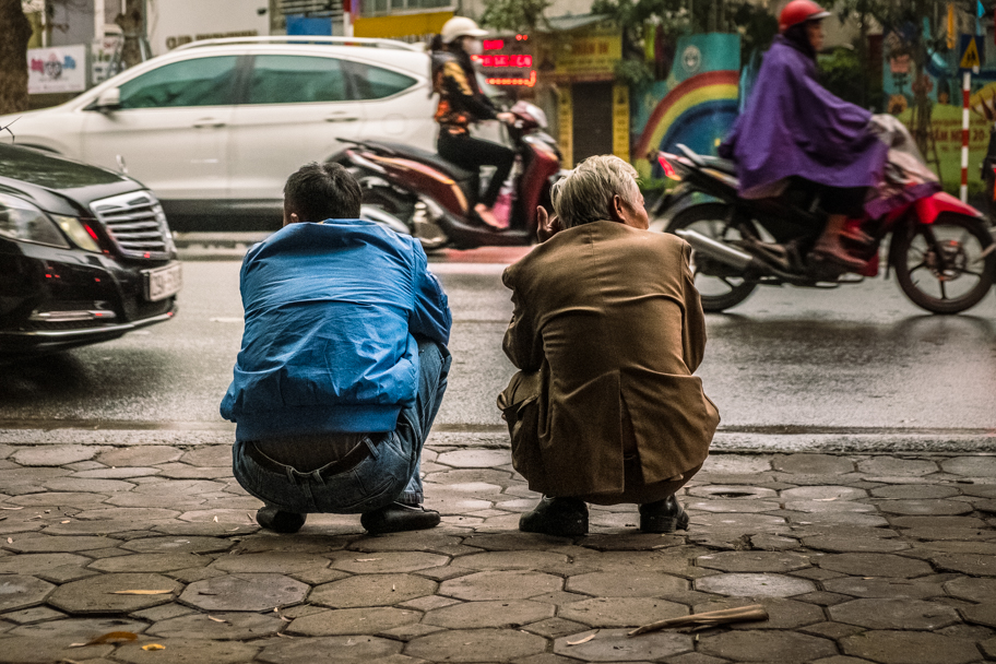 Vietnamese men squat roadside, Hanoi, Vietnam | Barbara Cameron Pix | Food & Travel Photographer