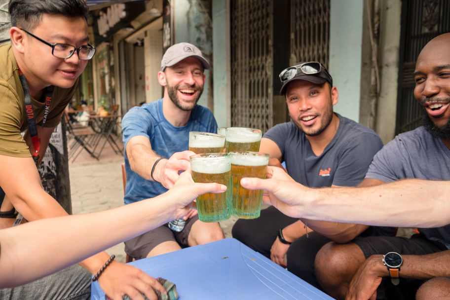 Friends cheer with fresh beer in Hanoi, Vietnam | Barbara Cameron Pix | Food & Travel Photographer