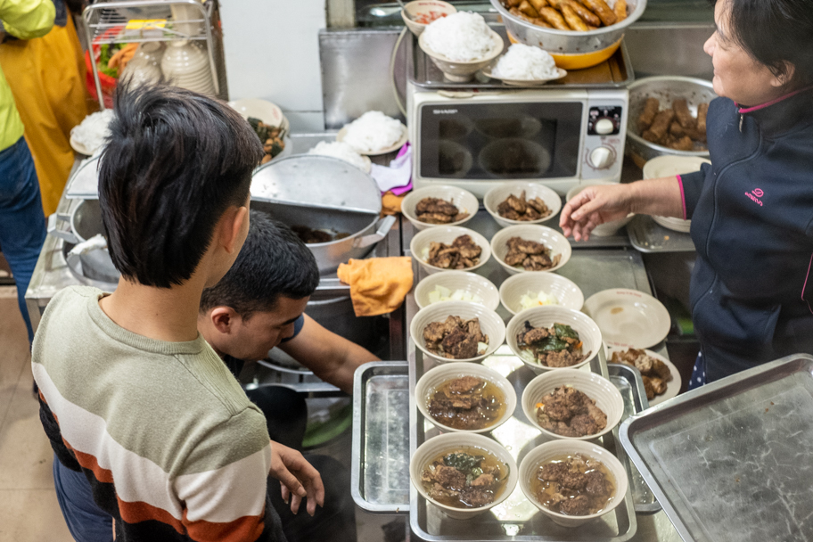 Many bowls of bun cha lined up in a restaurant in Hanoi, Vietnam. Photo by Barbara Cameron Pix, Food & Travel Photographer